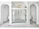 Luxurious walk-in shower with mosaic tile floor, dual shower heads, and arched doorways at 25303 Ludwell, Chapel Hill, NC 27517