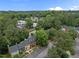 Neighborhood aerial view with townhouses, mature trees, and convenient parking at 3100 Coachmans Way, Durham, NC 27705