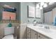 Cozy bathroom with decorative tiles, functional toilet, vanity, and ample lighting at 3100 Coachmans Way, Durham, NC 27705