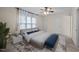 Inviting bedroom with a ceiling fan and plenty of natural light at 3100 Coachmans Way, Durham, NC 27705