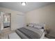Calm bedroom with a neutral color scheme and a walk-in closet at 3100 Coachmans Way, Durham, NC 27705