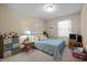 Bright bedroom with blue accents, a comfortable bed, and ample storage at 3100 Coachmans Way, Durham, NC 27705
