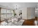 Charming dining room featuring a modern chandelier, a well-set table, and hardwood floors at 3100 Coachmans Way, Durham, NC 27705