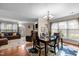 Open concept dining area with wood floors and view of the living room at 3100 Coachmans Way, Durham, NC 27705