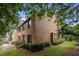 Side view of brick townhome with a manicured lawn at 3100 Coachmans Way, Durham, NC 27705