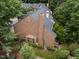 Brick townhome showing the brick detail and landscaped yard at 3100 Coachmans Way, Durham, NC 27705
