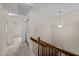 Upstairs hallway features carpet and a laundry area at 3100 Coachmans Way, Durham, NC 27705