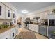 Bright kitchen with stainless appliances, striped walls and eat-in dining area at 3100 Coachmans Way, Durham, NC 27705