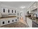 Well-lit kitchen boasting granite countertops and neutral cabinetry with an eat-in area at 3100 Coachmans Way, Durham, NC 27705