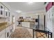 Charming kitchen boasting stainless steel appliances, granite countertops, and an adjacent dining area at 3100 Coachmans Way, Durham, NC 27705