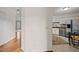 Bright kitchen featuring white cabinets, stainless steel appliances, and a connecting view to the living spaces at 3100 Coachmans Way, Durham, NC 27705