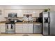 Spacious kitchen featuring granite countertops, stainless appliances, and ample cabinet space at 3100 Coachmans Way, Durham, NC 27705