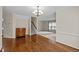 Open concept living room with hardwood flooring and a staircase at 3100 Coachmans Way, Durham, NC 27705