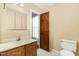 Bathroom with a vanity sink, toilet, and a tub shower with white tile at 3109 E Folkestone Pl, Raleigh, NC 27604