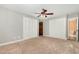 Bedroom with two closets, an entrance to an ensuite bathroom and a ceiling fan at 3109 E Folkestone Pl, Raleigh, NC 27604