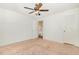 Bedroom with neutral walls, carpet, a ceiling fan, and a door to a hallway at 3109 E Folkestone Pl, Raleigh, NC 27604