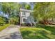 Charming two-story home with a bay window and a well-manicured lawn at 3109 E Folkestone Pl, Raleigh, NC 27604