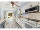 Bright kitchen with sleek appliances, ample cabinet space, and a large window overlooking the yard at 3109 E Folkestone Pl, Raleigh, NC 27604