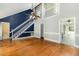 Spacious living room boasting hardwood floors, soaring ceilings, and an open layout at 3109 E Folkestone Pl, Raleigh, NC 27604