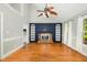 Bright living room showcasing hardwood floors, a fireplace with built-ins, and natural light at 3109 E Folkestone Pl, Raleigh, NC 27604