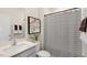 Clean bathroom with a shower, a vanity, and a modern design at 320 Hanging Elm Ln, Fuquay Varina, NC 27526