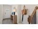 Inviting entryway with a white front door, wood floors, a console table and staircase leading to the upper level at 320 Hanging Elm Ln, Fuquay Varina, NC 27526