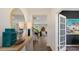 Welcoming hallway featuring elegant decor, wood flooring, and a glimpse into the adjacent living spaces at 320 Hanging Elm Ln, Fuquay Varina, NC 27526