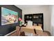 Bright home office with a decorative rug, large desk, ample storage space, and natural light at 320 Hanging Elm Ln, Fuquay Varina, NC 27526