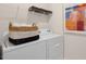 Practical laundry room with modern washer, dryer, and storage options at 320 Hanging Elm Ln, Fuquay Varina, NC 27526