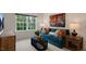 Bright living room with a sofa and large window at 320 Hanging Elm Ln, Fuquay Varina, NC 27526