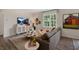 Inviting living room with a large window, a TV, and stylish decor at 320 Hanging Elm Ln, Fuquay Varina, NC 27526