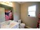This bathroom has a vanity, a toilet, and a bathtub with a decorative shower curtain at 3219 Ranbir Dr, Durham, NC 27713