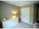 Neutral toned bedroom with a dresser at 3219 Ranbir Dr, Durham, NC 27713