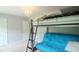 Bedroom features a bunk bed with large windows, a chandelier, and a door on the other side at 3219 Ranbir Dr, Durham, NC 27713