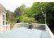 Spacious deck with grill and string lights, creating a cozy atmosphere for outdoor entertaining and relaxing at 3219 Ranbir Dr, Durham, NC 27713