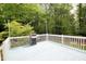 Open deck with grilling station overlooking a wooded yard; perfect for outdoor relaxation and entertaining at 3219 Ranbir Dr, Durham, NC 27713