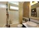 Compact bathroom with modern fixtures, a decorative shower curtain, and warm lighting at 33 Blackhorn Ct, Pittsboro, NC 27312