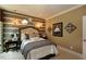 Cozy bedroom with unique wall decor, soft lighting, and comfortable furnishings at 33 Blackhorn Ct, Pittsboro, NC 27312