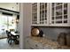 Stylish butlers pantry with granite countertops and a view into the formal dining room at 33 Blackhorn Ct, Pittsboro, NC 27312