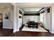 Open dining room featuring a large table, stylish decor, and views of the living room at 33 Blackhorn Ct, Pittsboro, NC 27312
