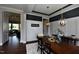 Elegant dining room with modern lighting and views into the living room at 33 Blackhorn Ct, Pittsboro, NC 27312