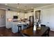 Modern kitchen with large island, stainless steel appliances, and adjacent dining area at 33 Blackhorn Ct, Pittsboro, NC 27312