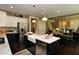 Well-equipped kitchen with a farmhouse sink, stainless steel appliances, and center island at 33 Blackhorn Ct, Pittsboro, NC 27312