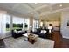 Bright living room with coffered ceiling, large windows and open to the kitchen at 33 Blackhorn Ct, Pittsboro, NC 27312