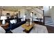 Open-concept living room flows into the kitchen, featuring a plush rug and modern decor at 33 Blackhorn Ct, Pittsboro, NC 27312