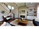 Inviting living room featuring a fireplace, staircase, and recessed lighting at 33 Blackhorn Ct, Pittsboro, NC 27312