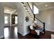 Bright staircase with white railings and dark wood steps, complemented by stylish decor at 33 Blackhorn Ct, Pittsboro, NC 27312