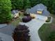 Lovely, illuminated estate with circular driveway and guest house surrounded by lush green trees at 3513 Forest Oaks Dr, Chapel Hill, NC 27514