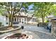 Expansive backyard featuring a patio, fire pit, and landscaping, perfect for outdoor living at 3513 Forest Oaks Dr, Chapel Hill, NC 27514