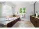 Bathroom with soaking tub and vanity at 3513 Forest Oaks Dr, Chapel Hill, NC 27514